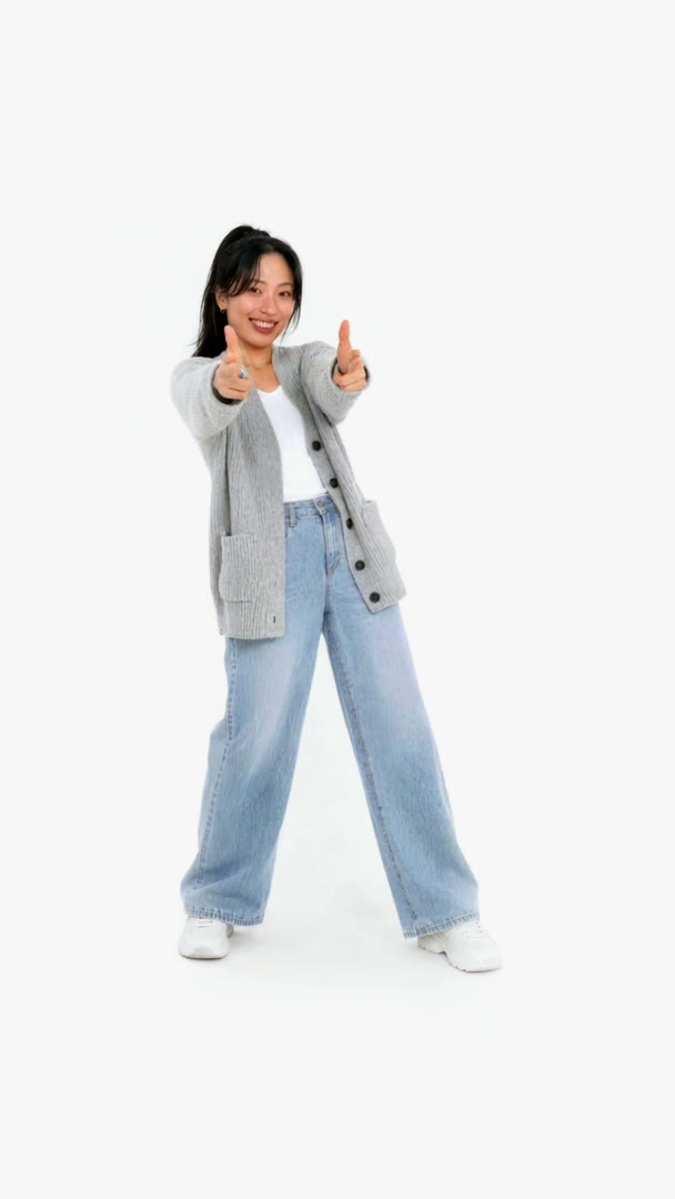 JiHee in a grey cardigan pointing two finger-guns at the camera